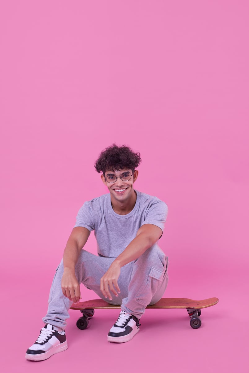 Bold & Punchy Headshots Young Man Sitting on a Skatebaord